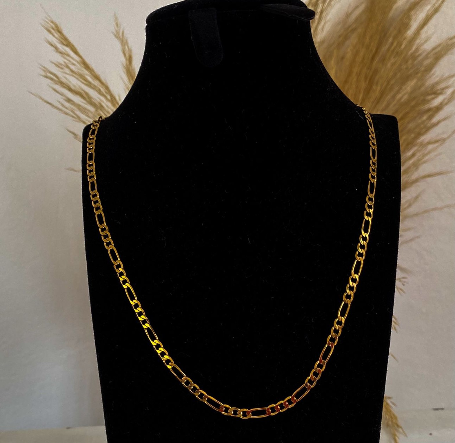 Gold figaro chain image