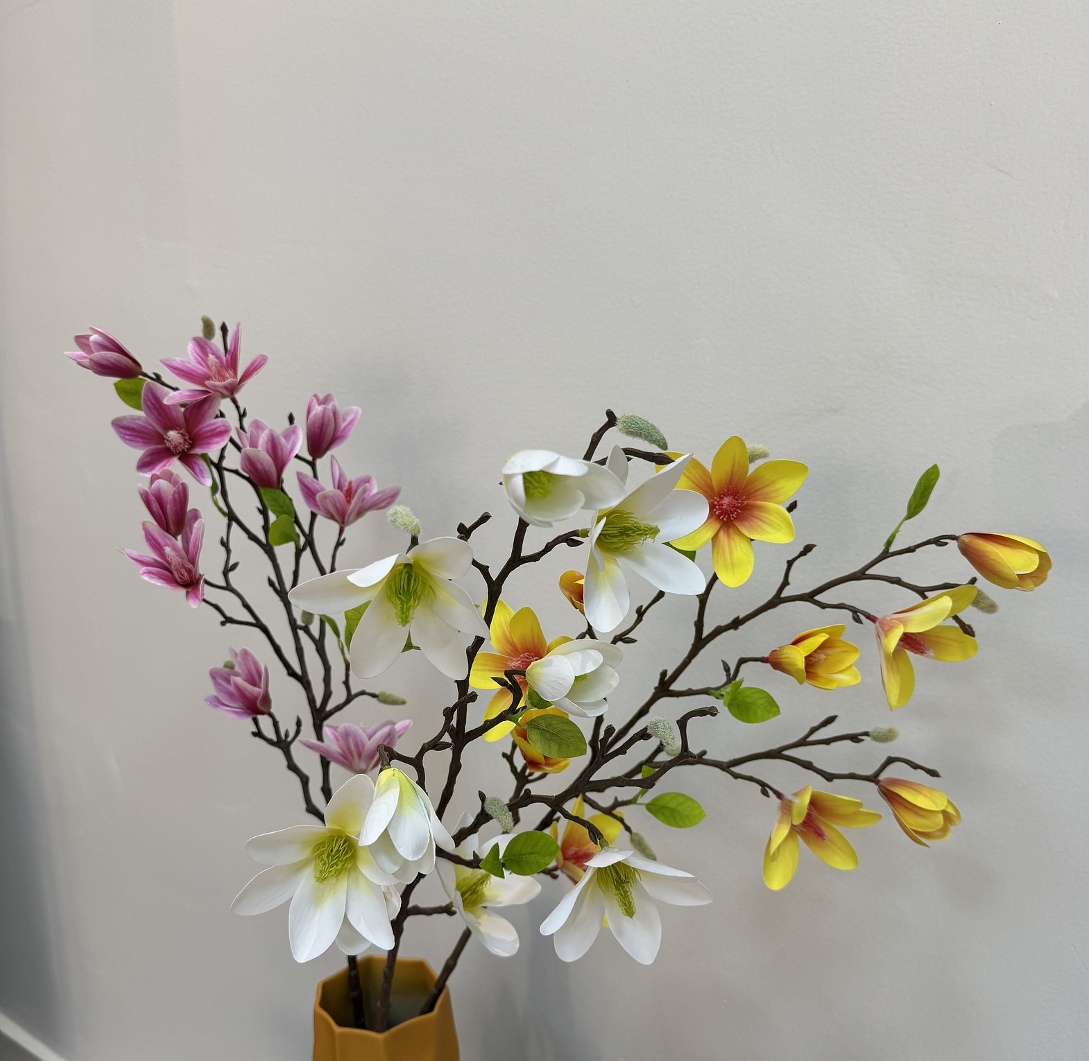 Faux blooming magnolia branches. image