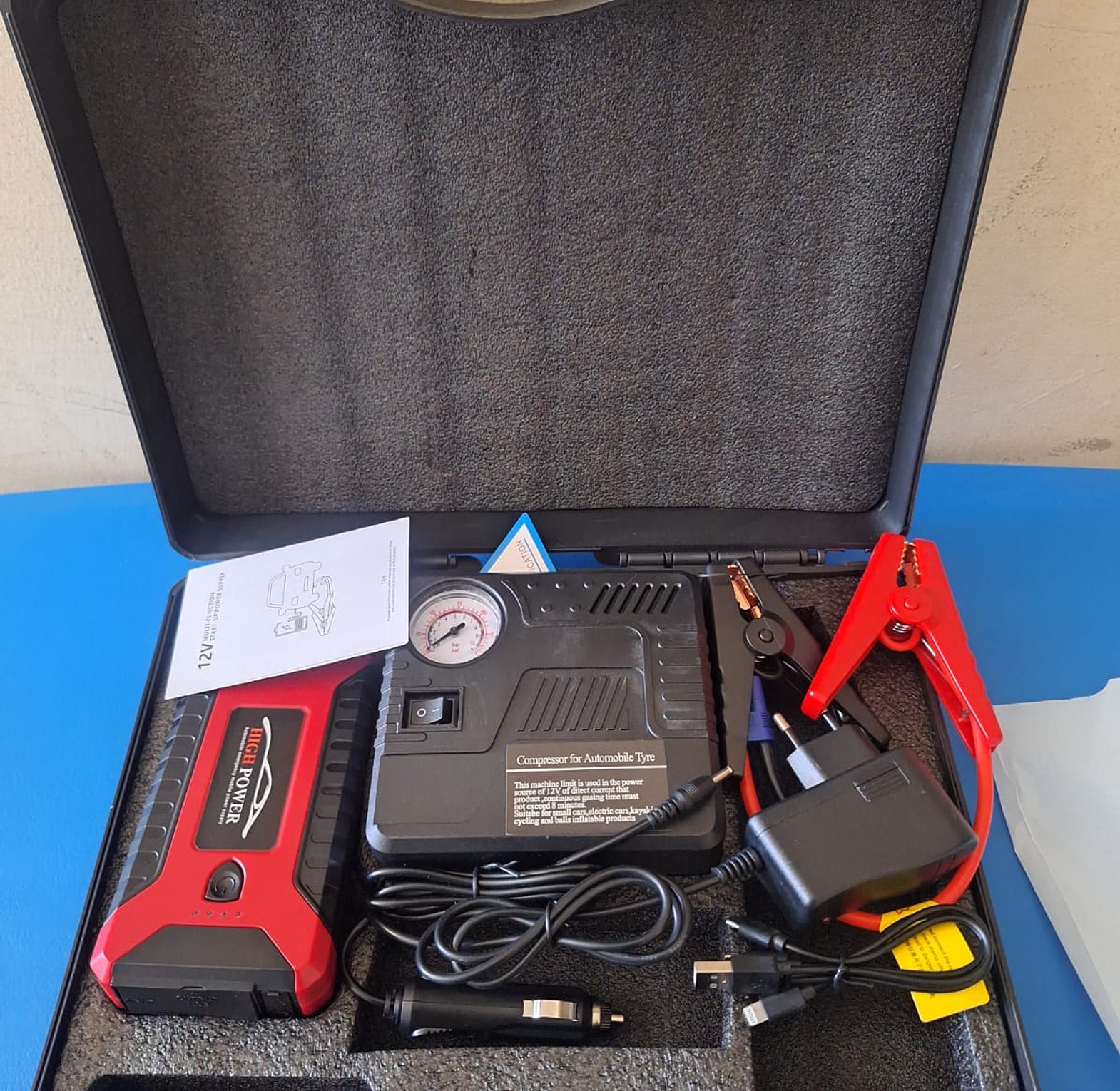 Car Jump Starter. Car jump starter Kit And air Compressor also act as a power bank for charging electronic devices. image