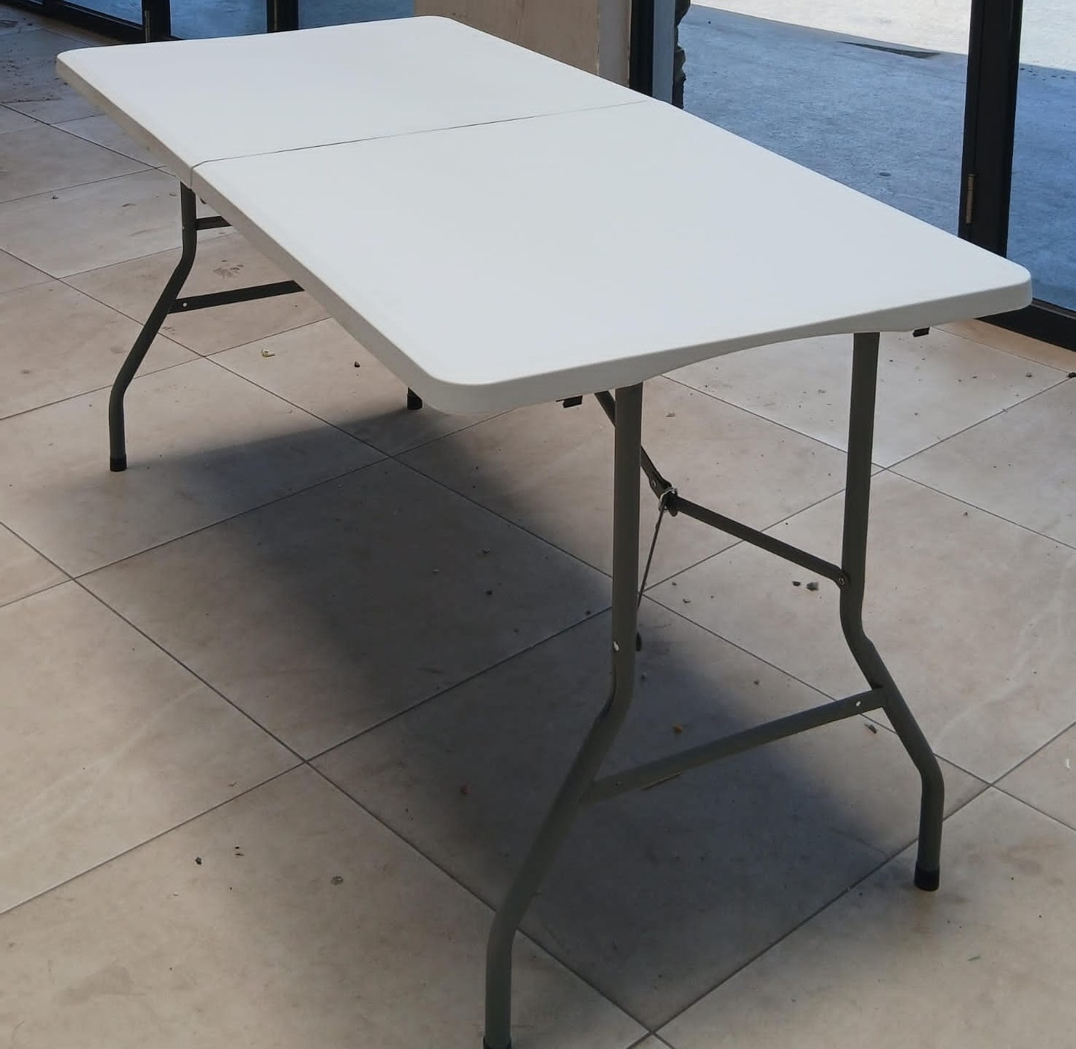 1.8m Rectangular Plastic Folding Table. Portable table often used for indoor and outdoor events, camping, As Dinning Table or extra utility space.  image