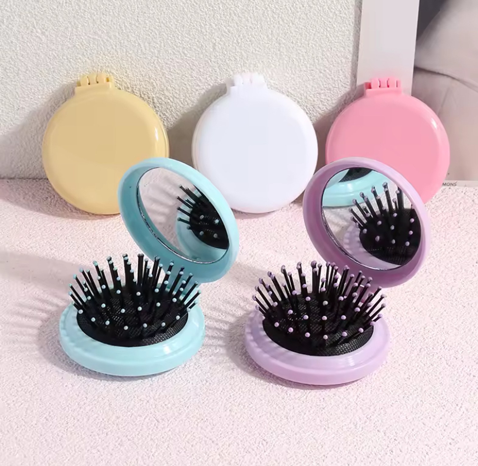 Mini pocket mirror with folding comb  image