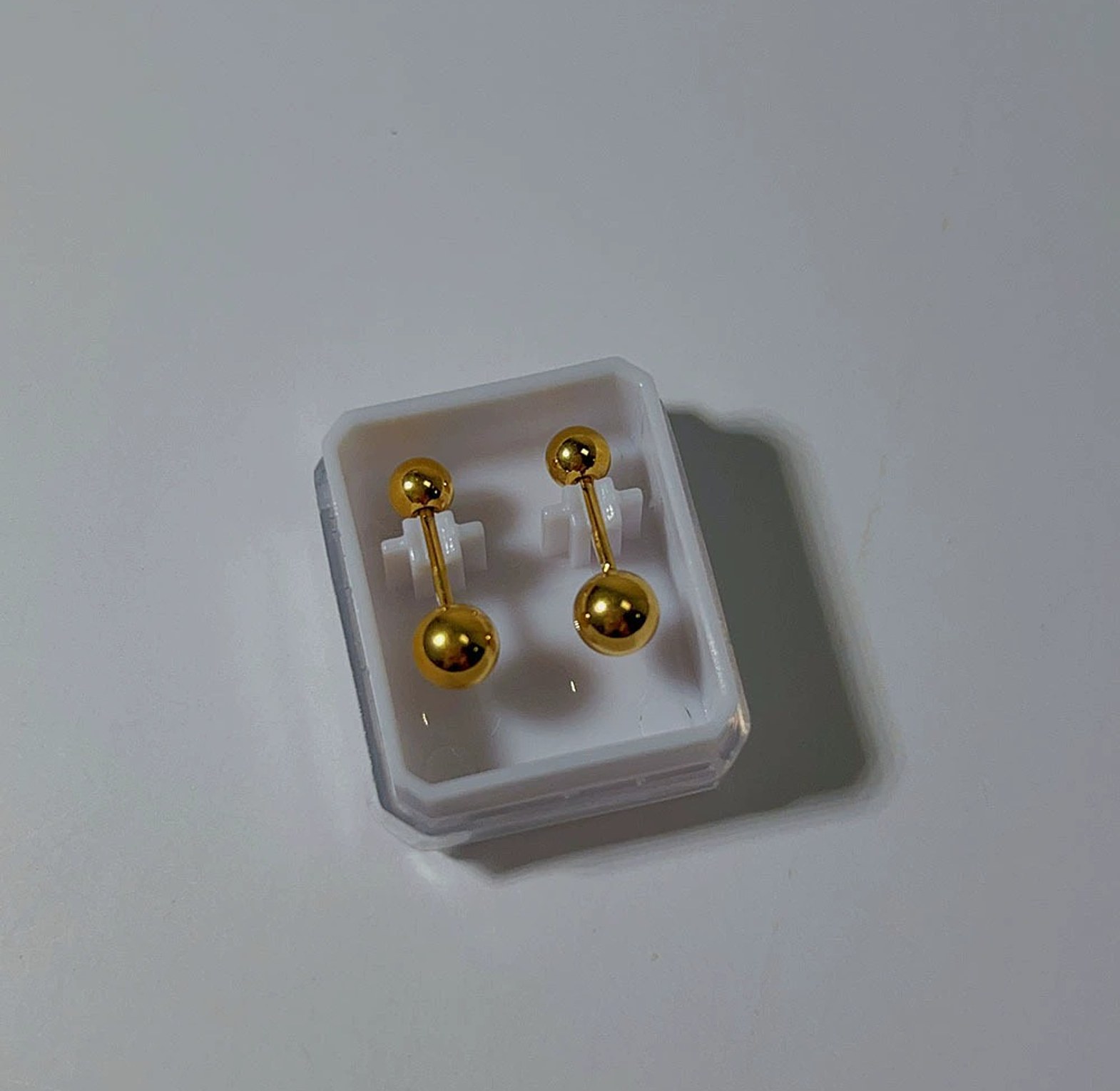 Double edge gold studs image