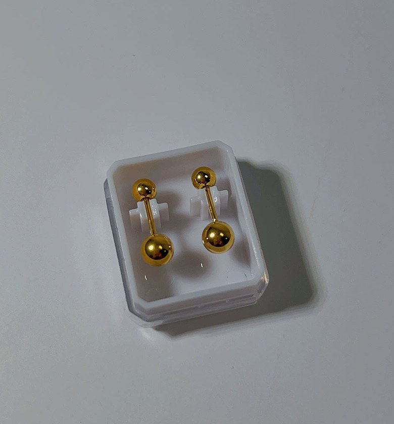 Double edge gold studs image