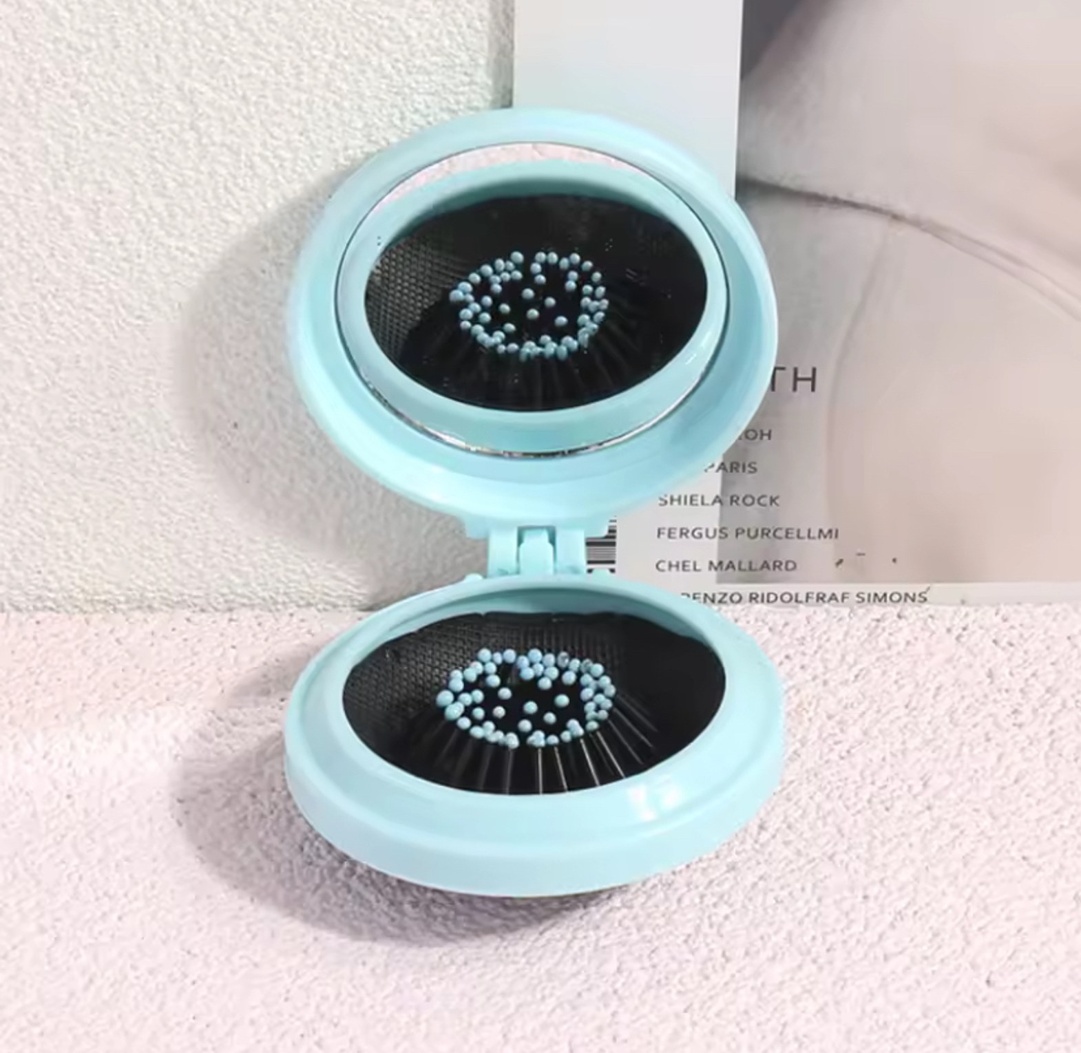 Mini pocket mirror with folding comb  image