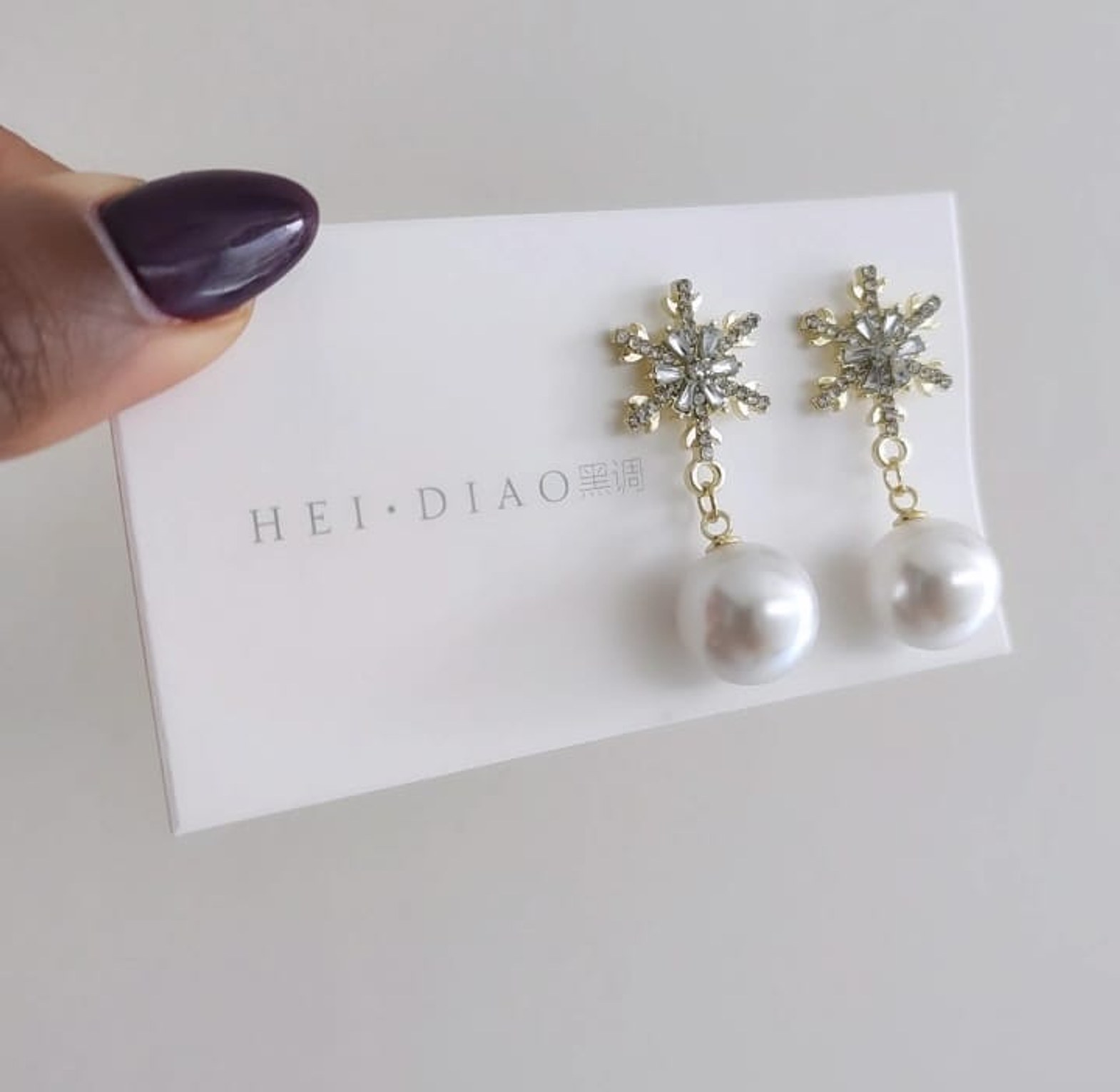 Gold snowflake pearl earrings  image