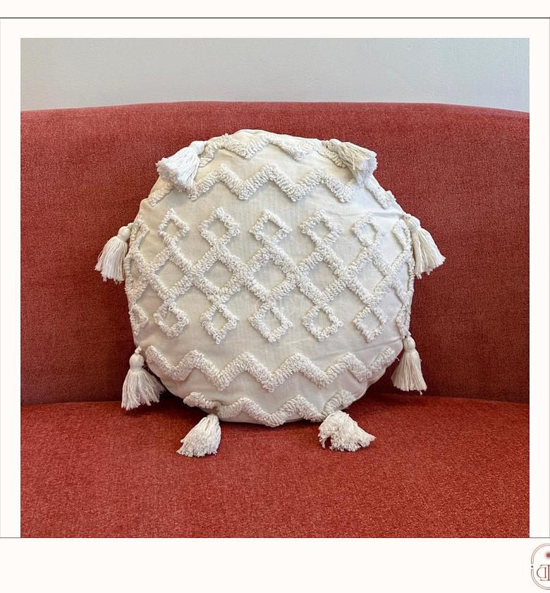 Off-white circular tufted cushion cover with pom poms image