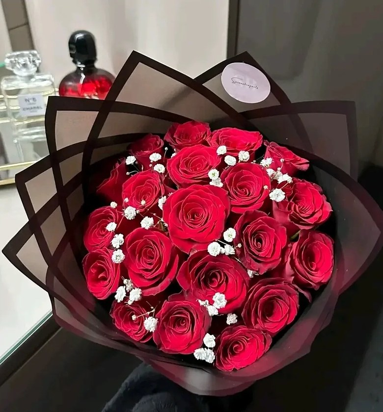 Red bouquet with white baby breathes. 25 stems image