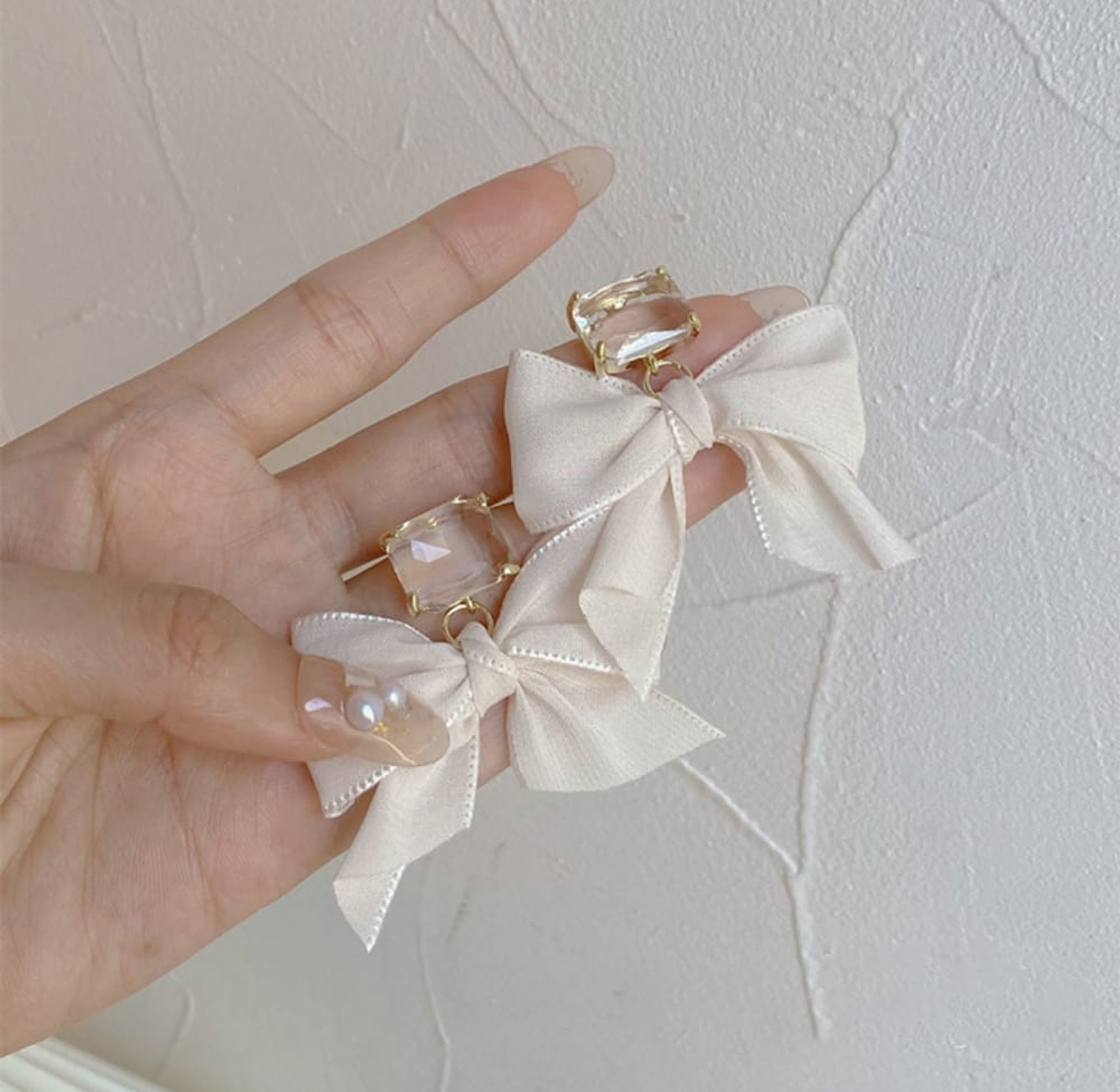 Beige bow crystal earrings image