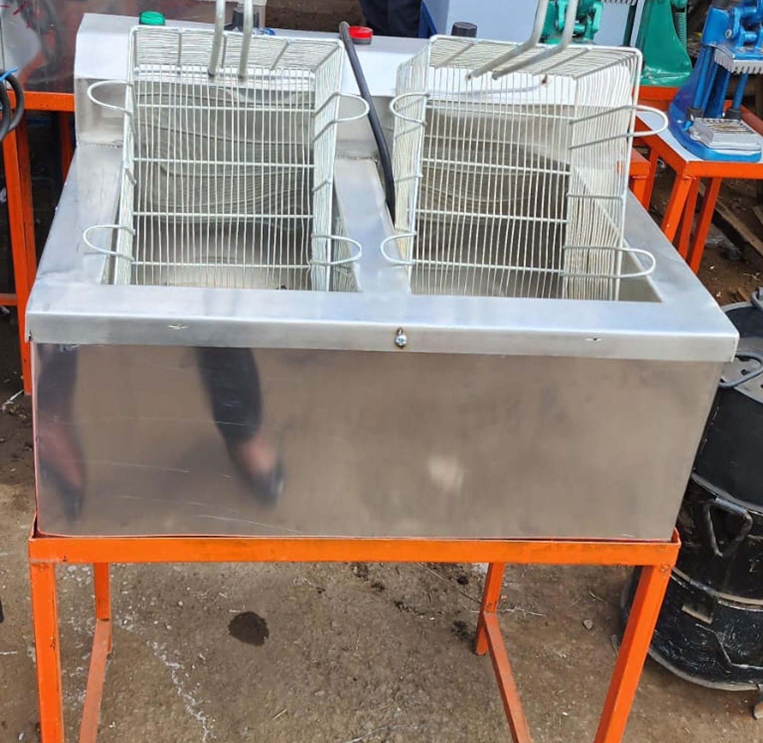Electric  Double -fryer Jua-kali. Commercial double deep fryer with a stand image