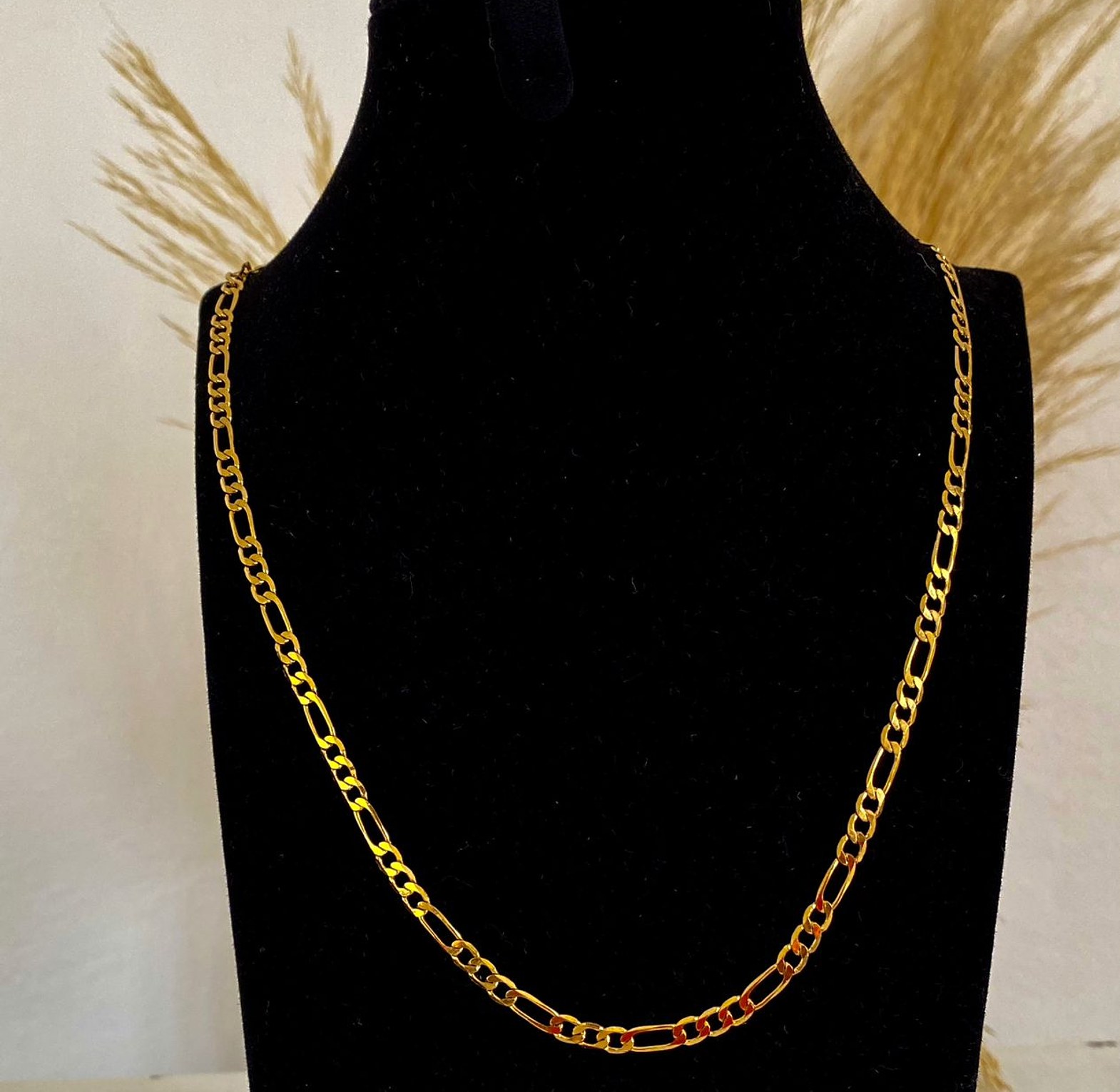 Gold figaro chain image