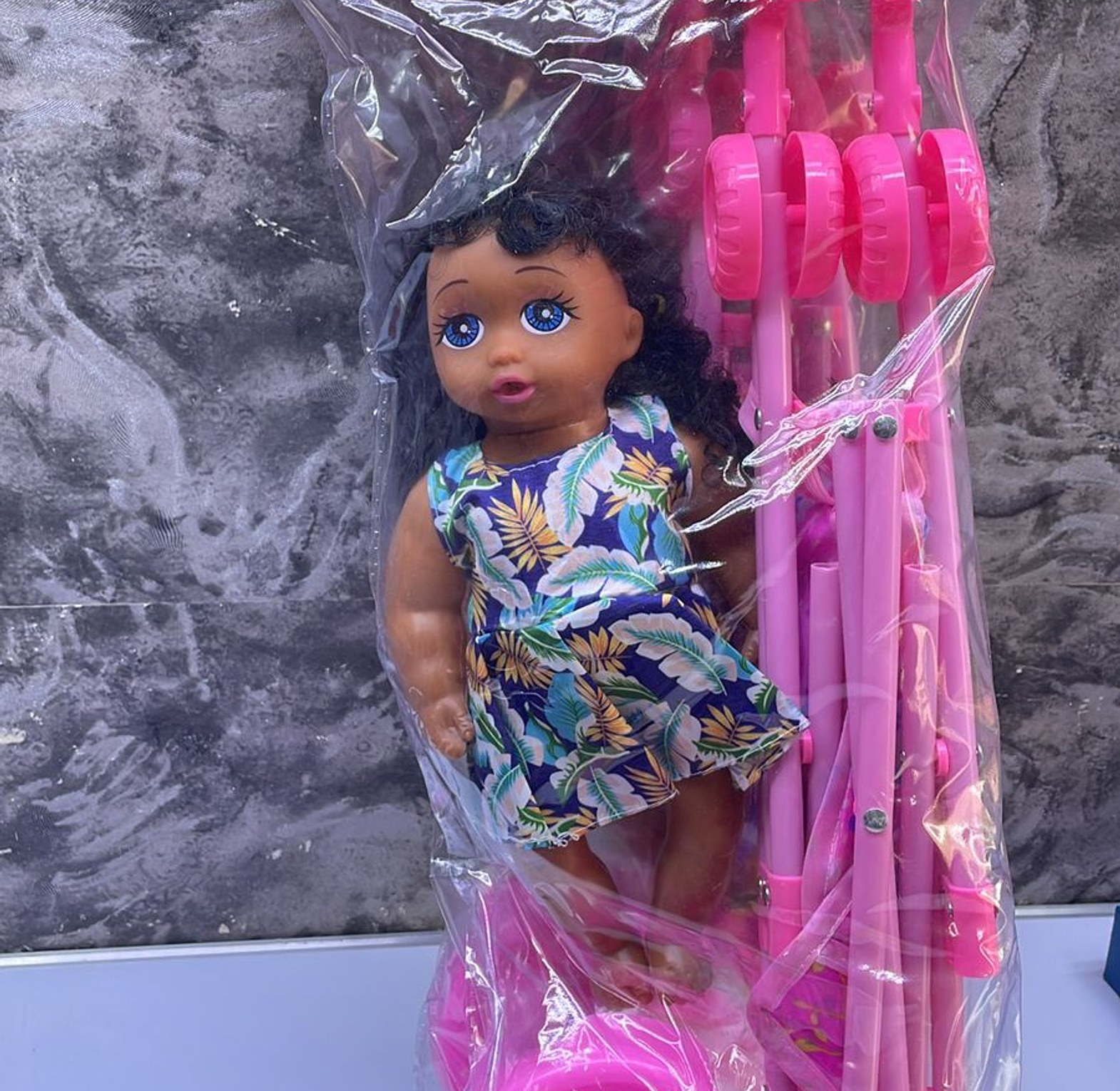 Doll plus a stroller  image