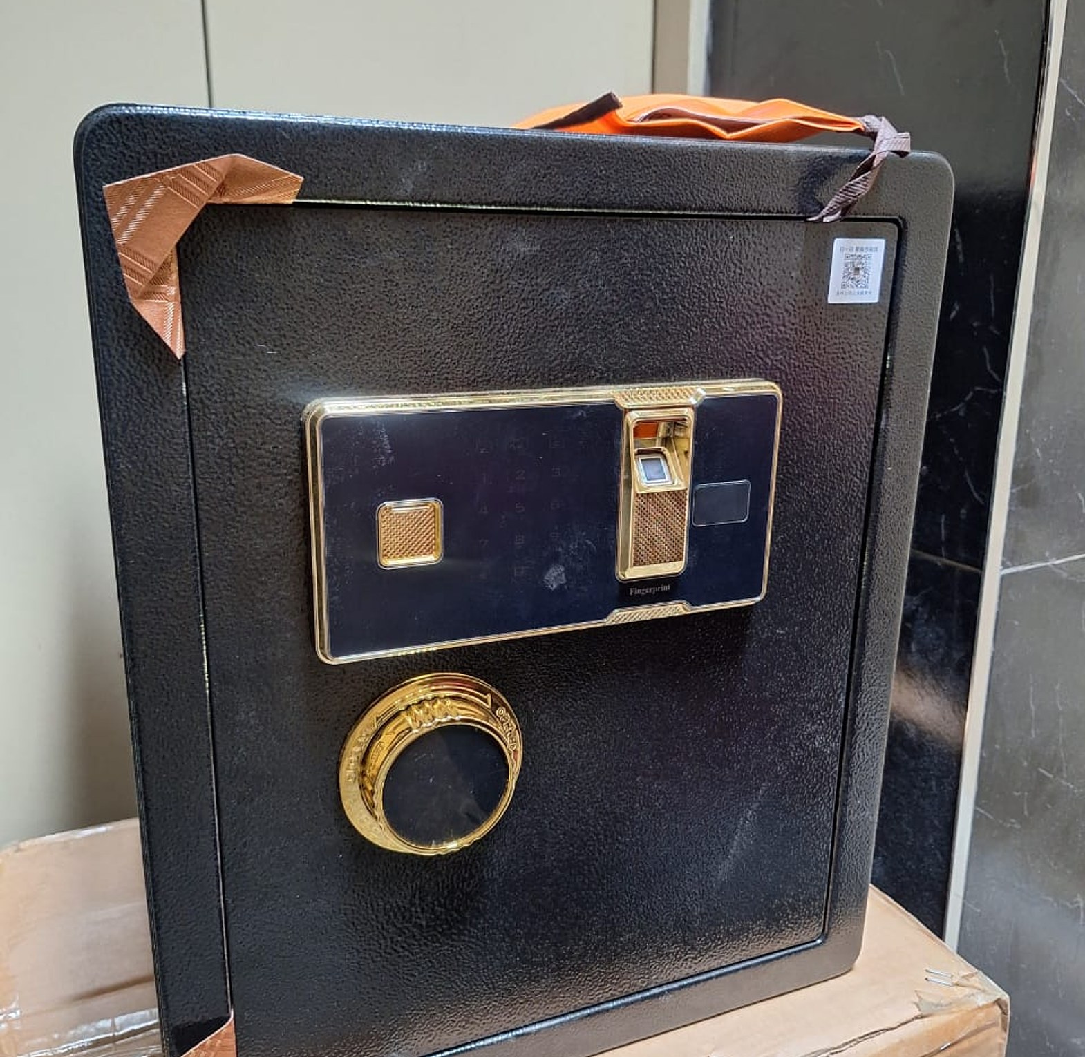 Biometric Fingerprint Safe Box. This is a large, black safe box designed for securing valuables, documents, and other important items.  image