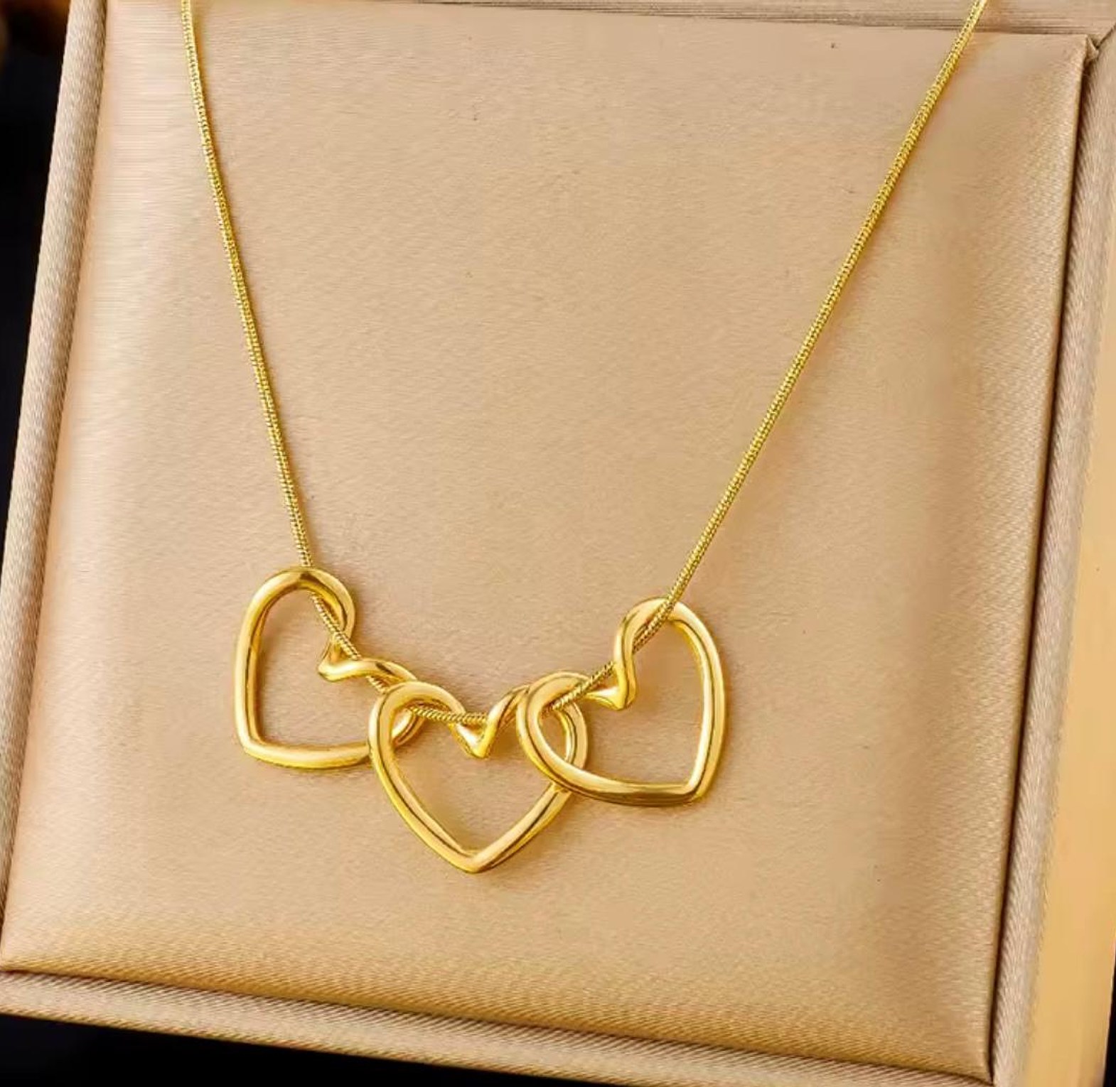 Amora Triple Heart Gold Statement Necklace image