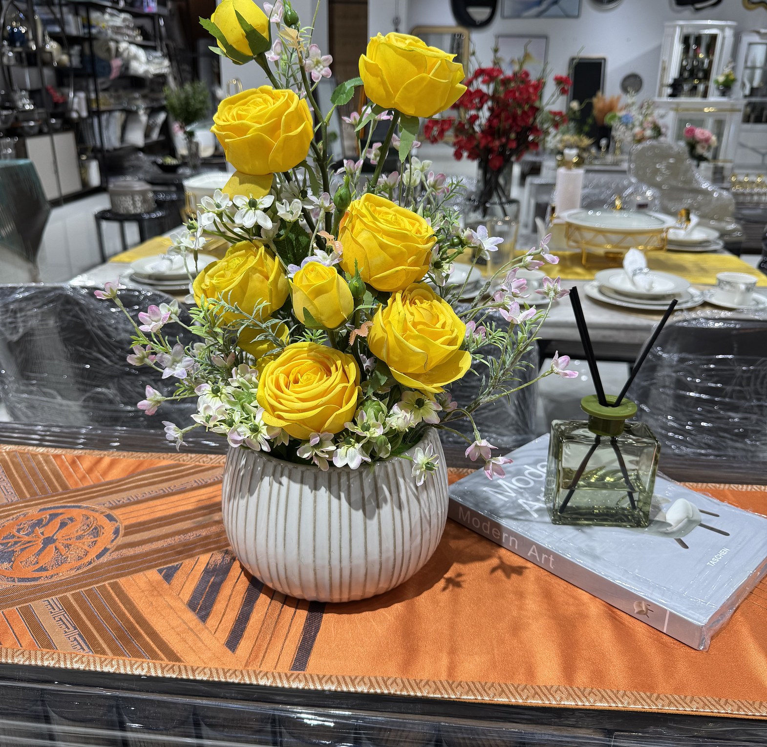 Elegant yellow roses in a white ribbed vase image