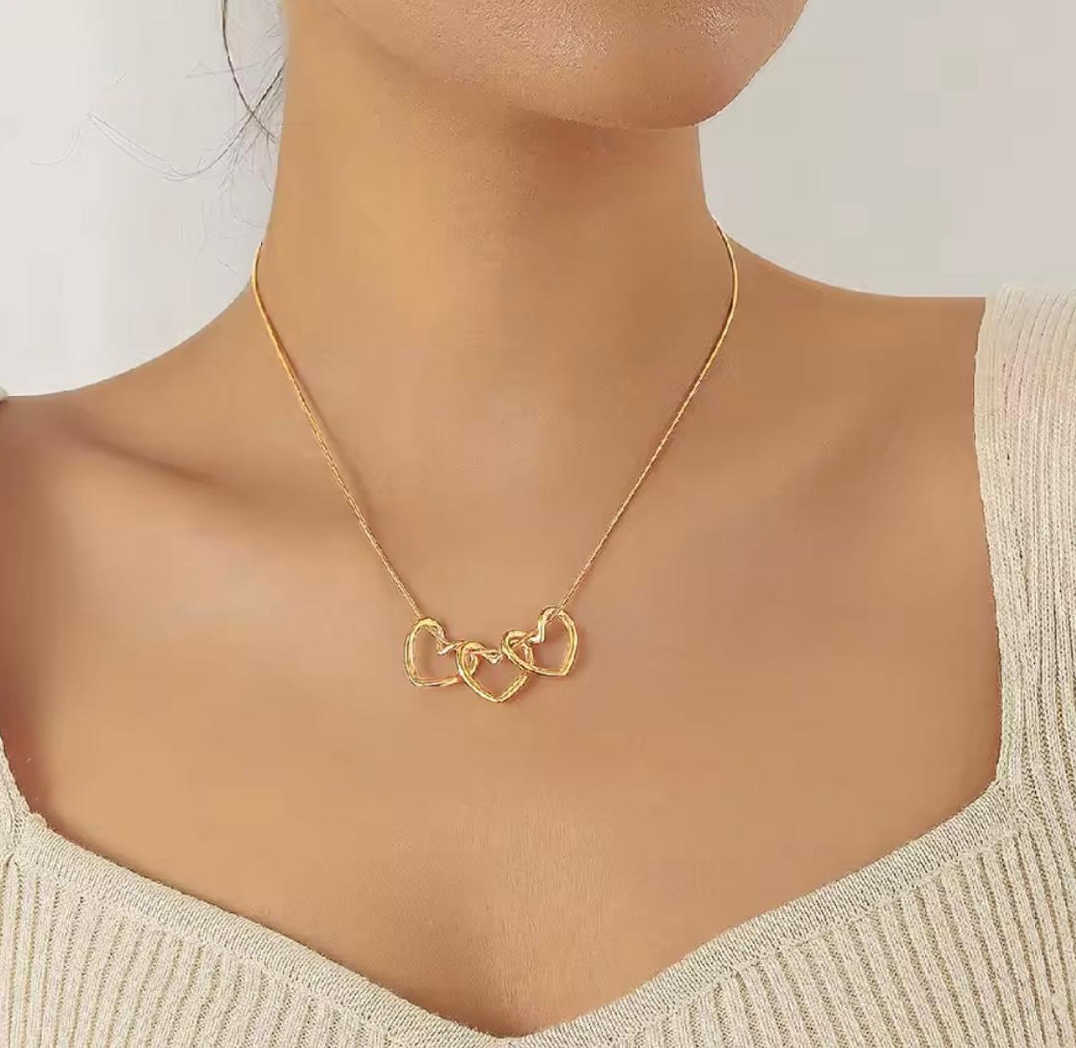 Amora Triple Heart Gold Statement Necklace image