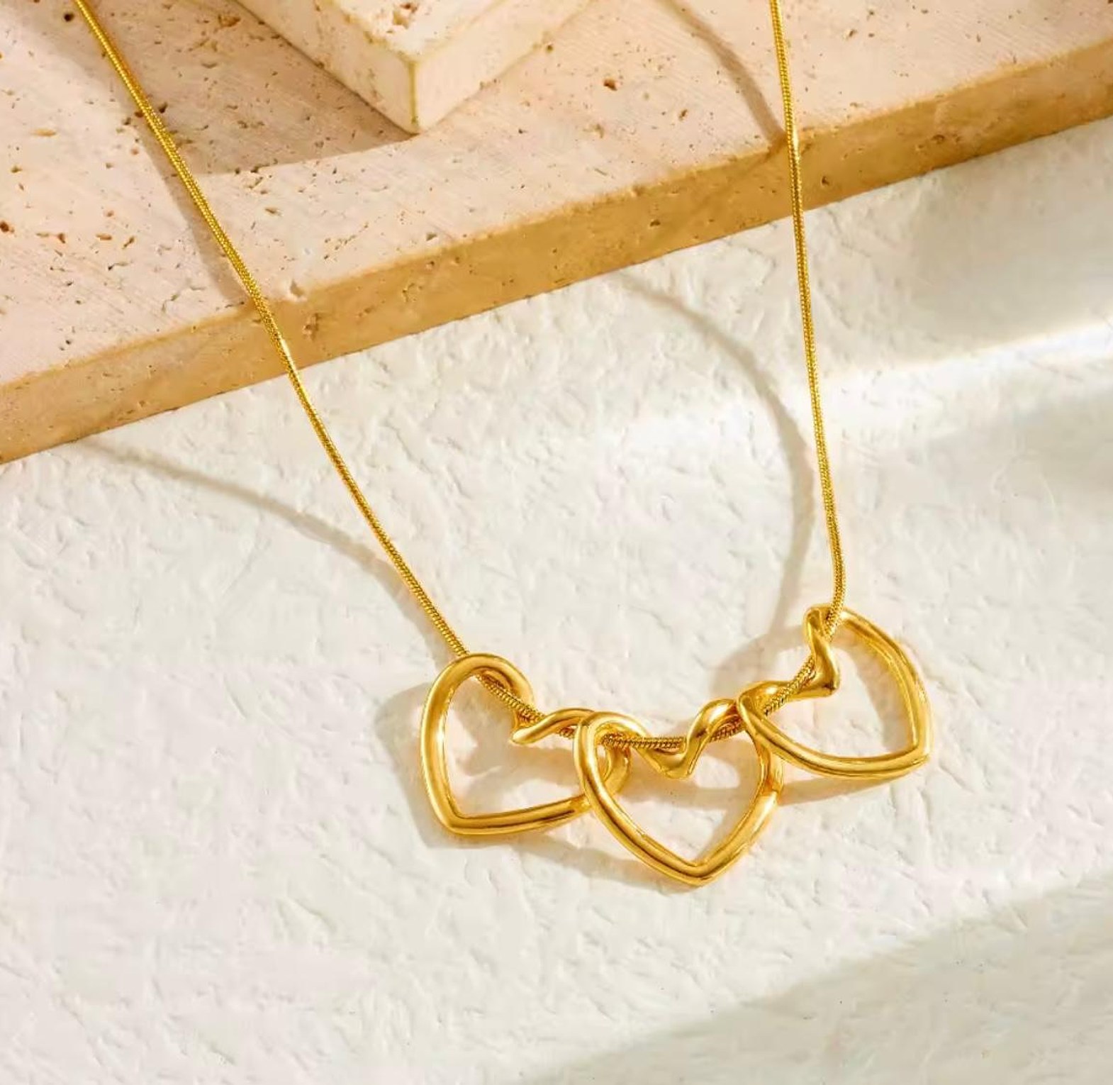 Amora Triple Heart Gold Statement Necklace image