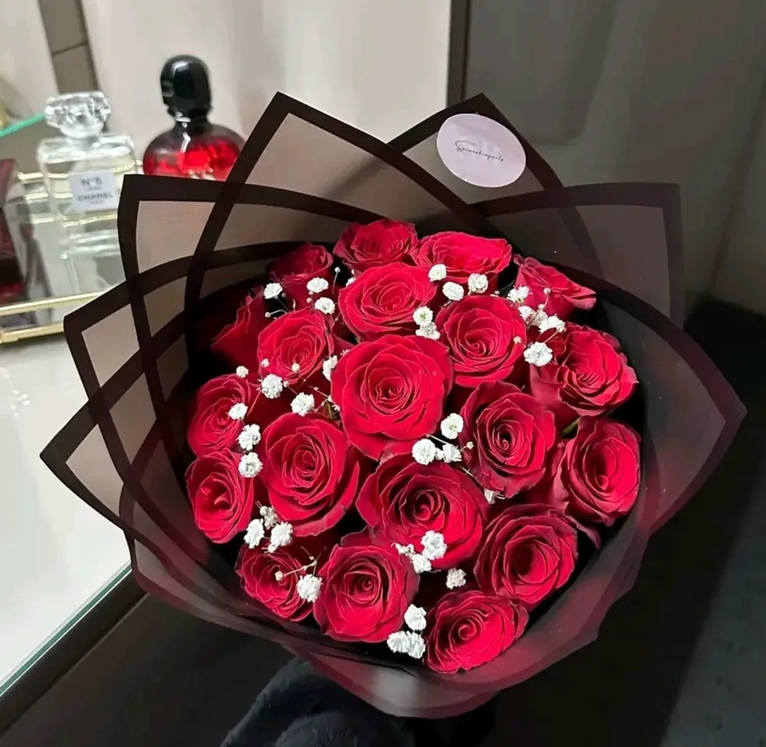 Red bouquet with white baby breathes. 25 stems image