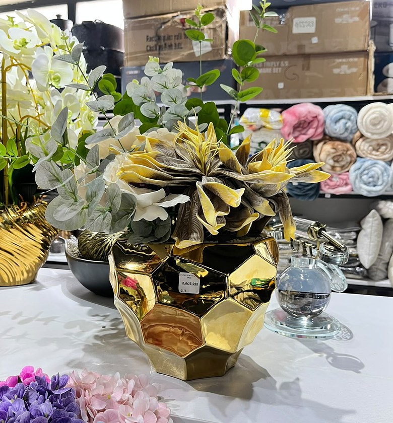 Artificial Flowers in Gold Vase image